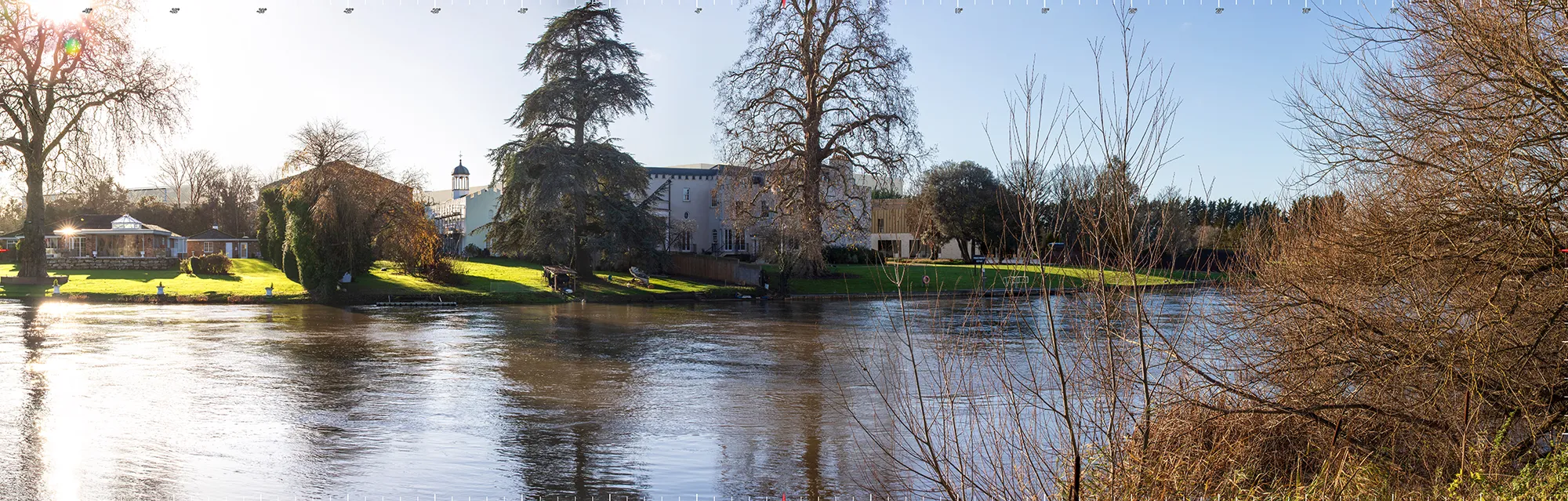 A computer generated image of a proposed studio redevelopment viewed across a river.