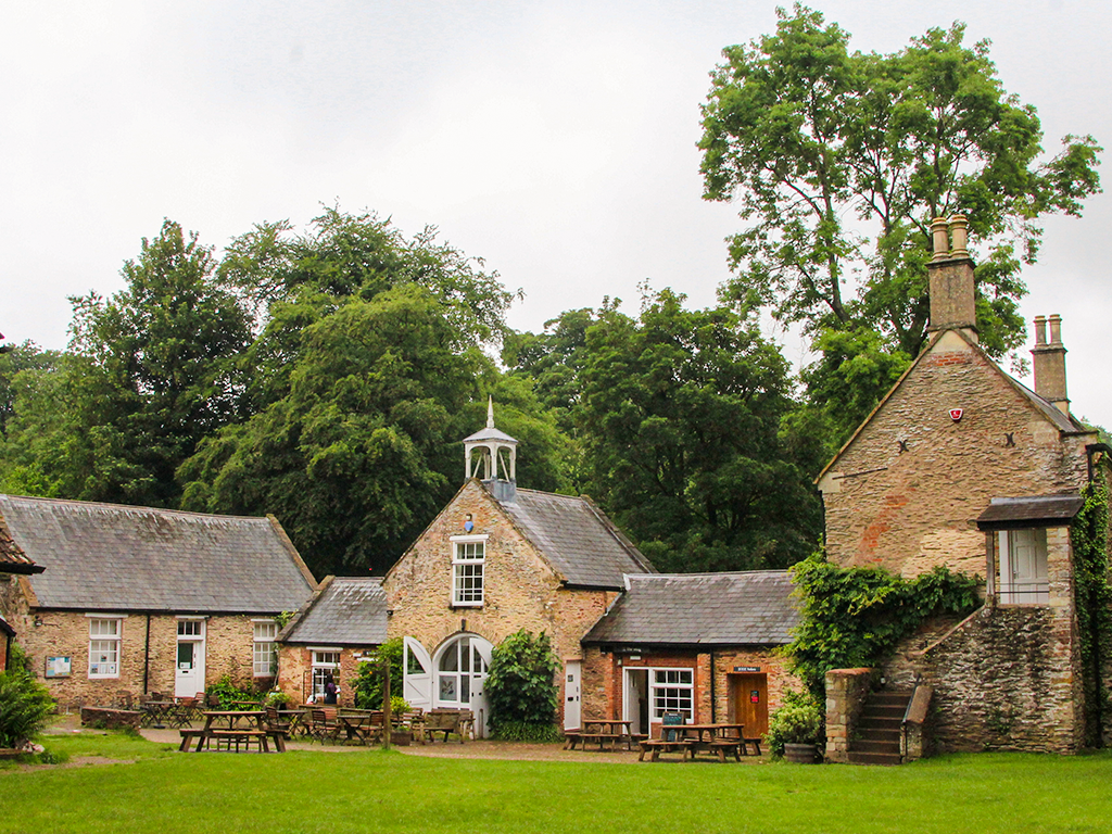 Historic courtyard buildings at Fyne Court estate in Somerset