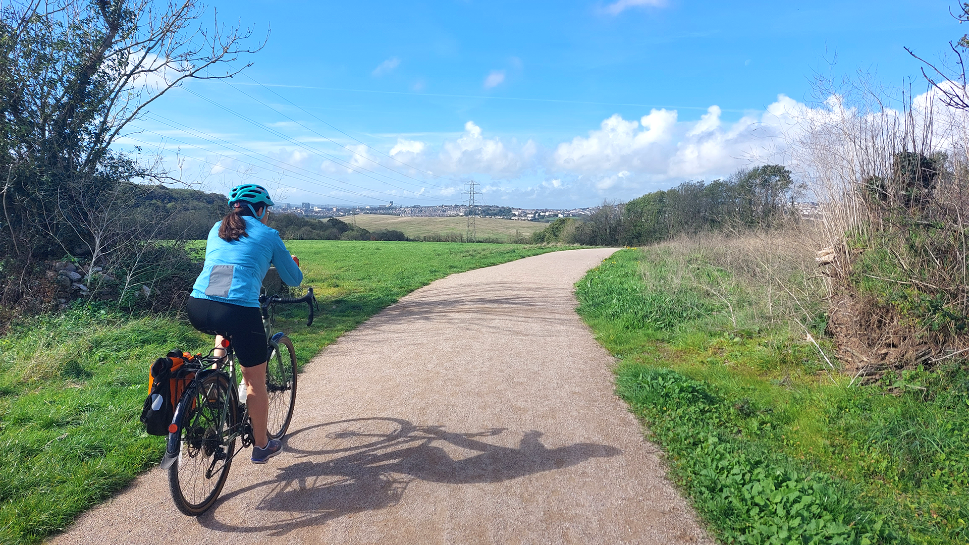 Cyclist using a new accessible multi-user trail at Saltram East Country Park in Plymouth